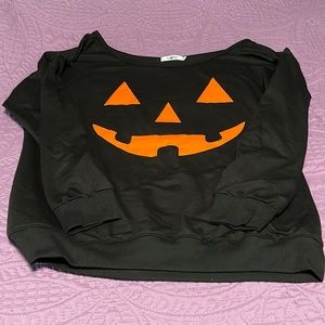 Off the shoulder pumpkin face sweatshirt
